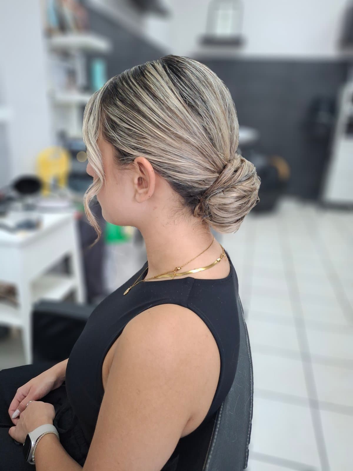 Low bun hairstyle side view